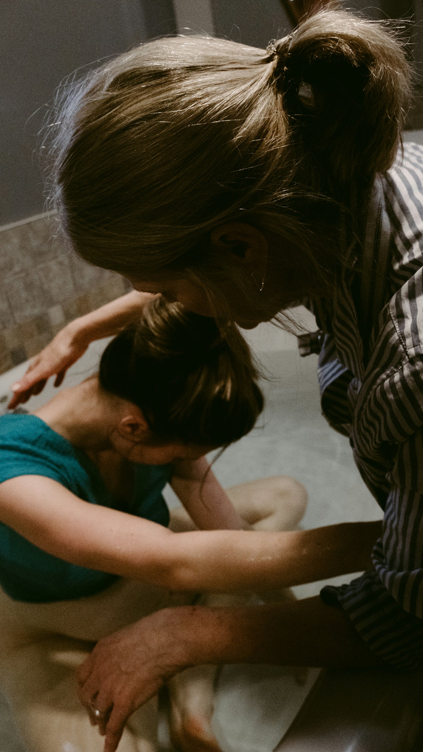 A doula supporting a woman in labor at home